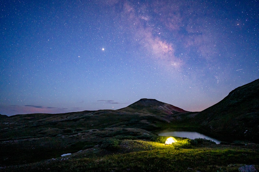 green mountain under blue sky during night time