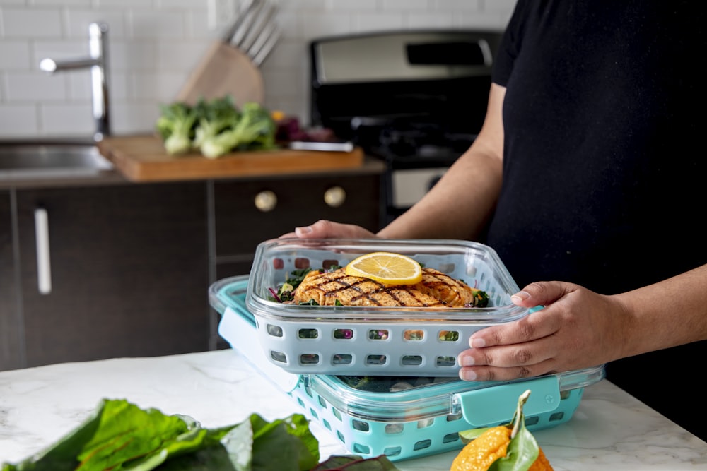 person holding tray with food