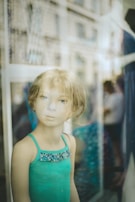 Mannequin with realistic facial features dressed in casual streetwear.