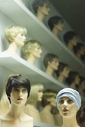 A collection of bridal hairstyles displayed on mannequins.