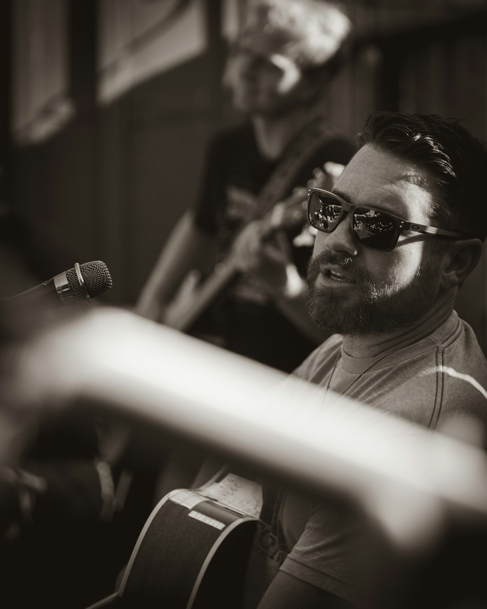 man in black sunglasses and white shirt