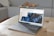A satisfied customer using a laptop with azadigi products on the screen.