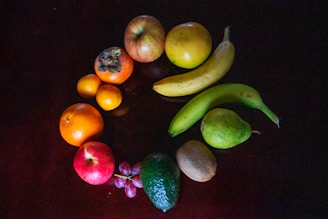 green banana orange and red apple fruits