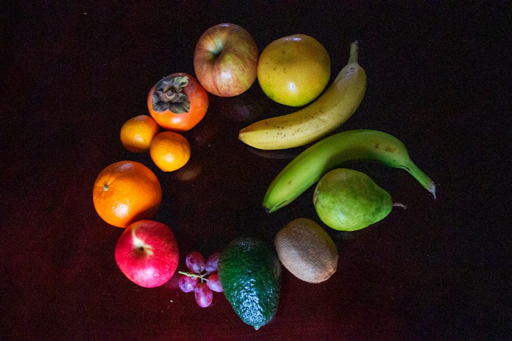 green banana orange and red apple fruits