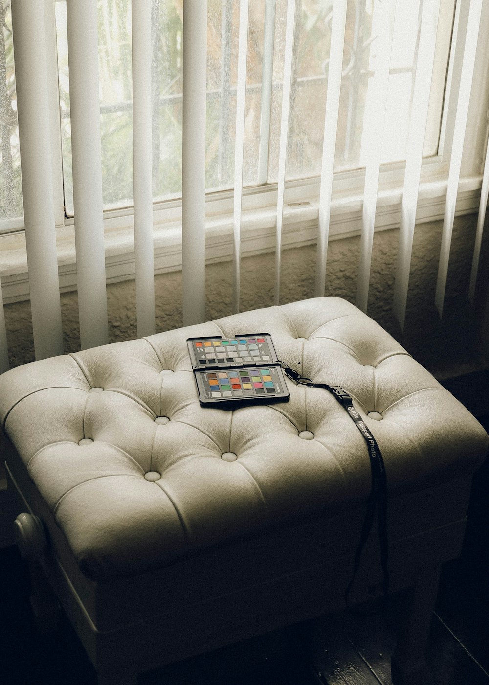 black ipad on white couch