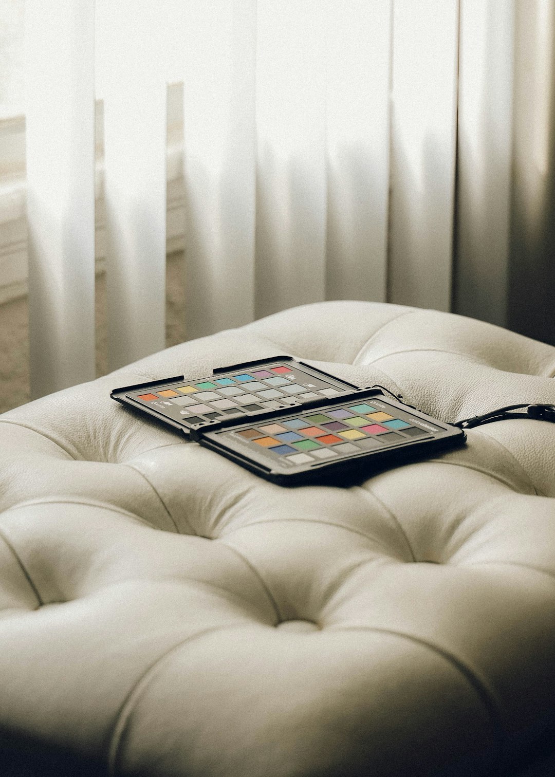 white ipad on white couch