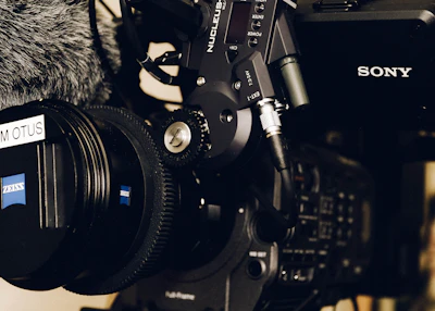 black and gray camera on black and white textile