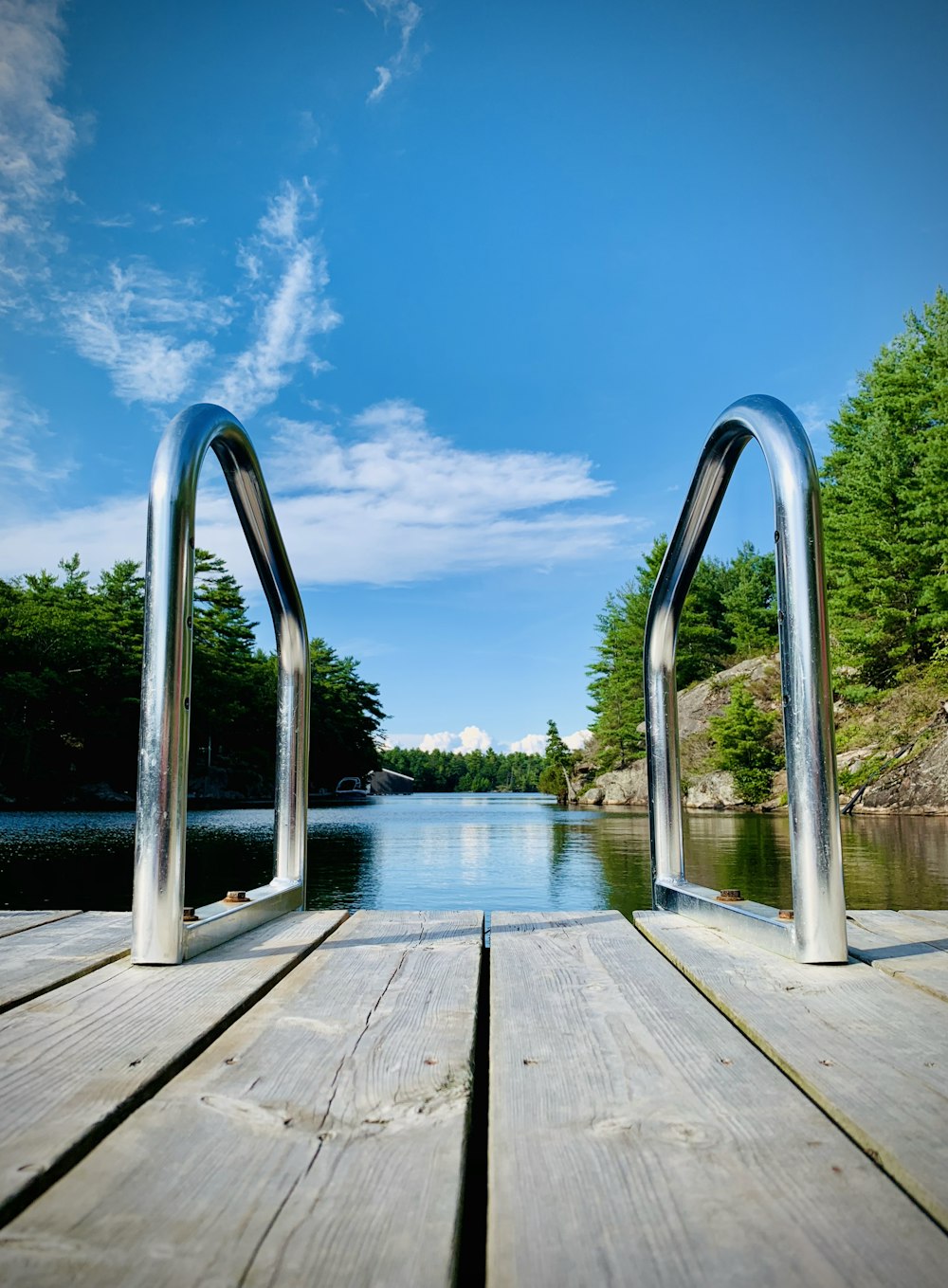 brown wooden dock on body of water during daytime