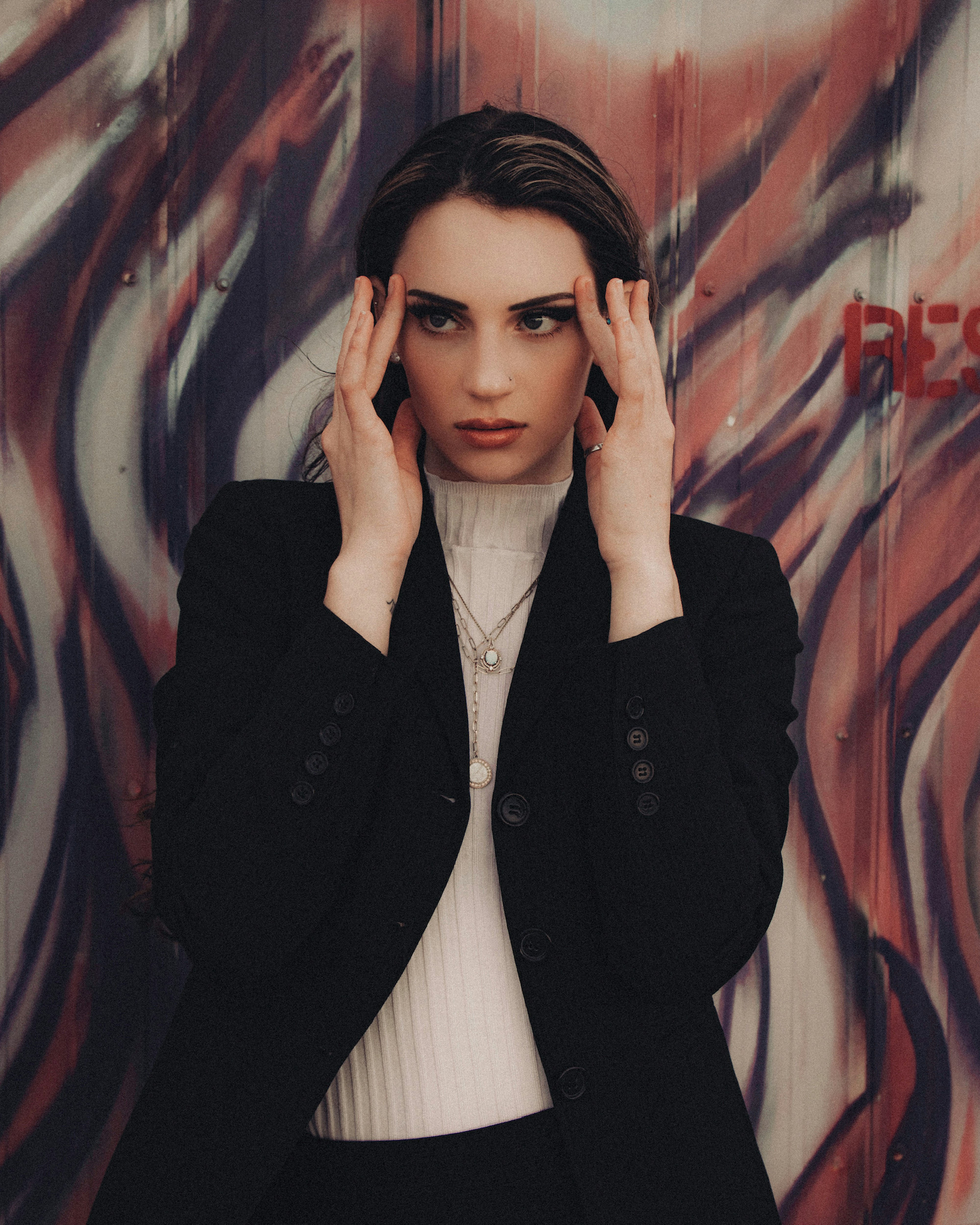 Woman in black blazer wearing black framed eyeglasses photo – Free