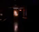 Photo of a sleek ADA-compliant sign glowing softly with backlighting in an office hallway.