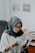 woman in white hijab and black framed eyeglasses