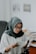 woman in white hijab and black framed eyeglasses
