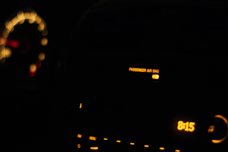 Close-up of a car dashboard with repaired airbag system indicators lit up.
