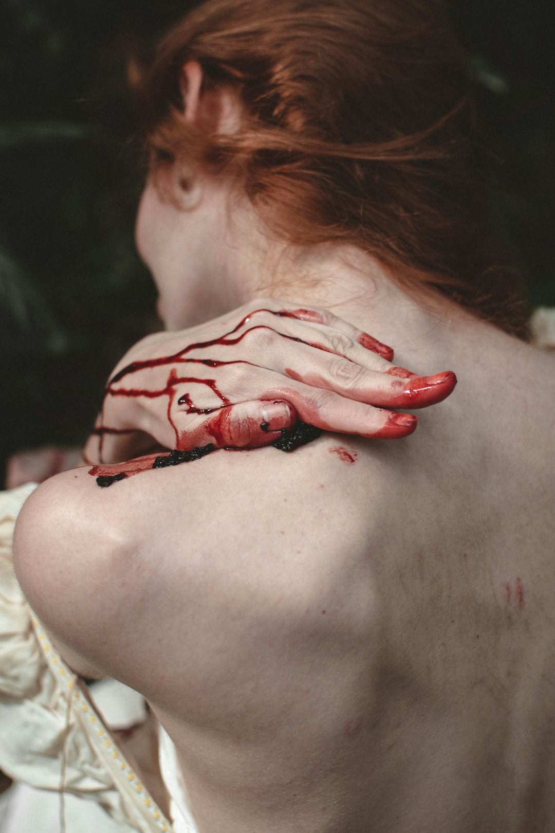 woman with red nail polish