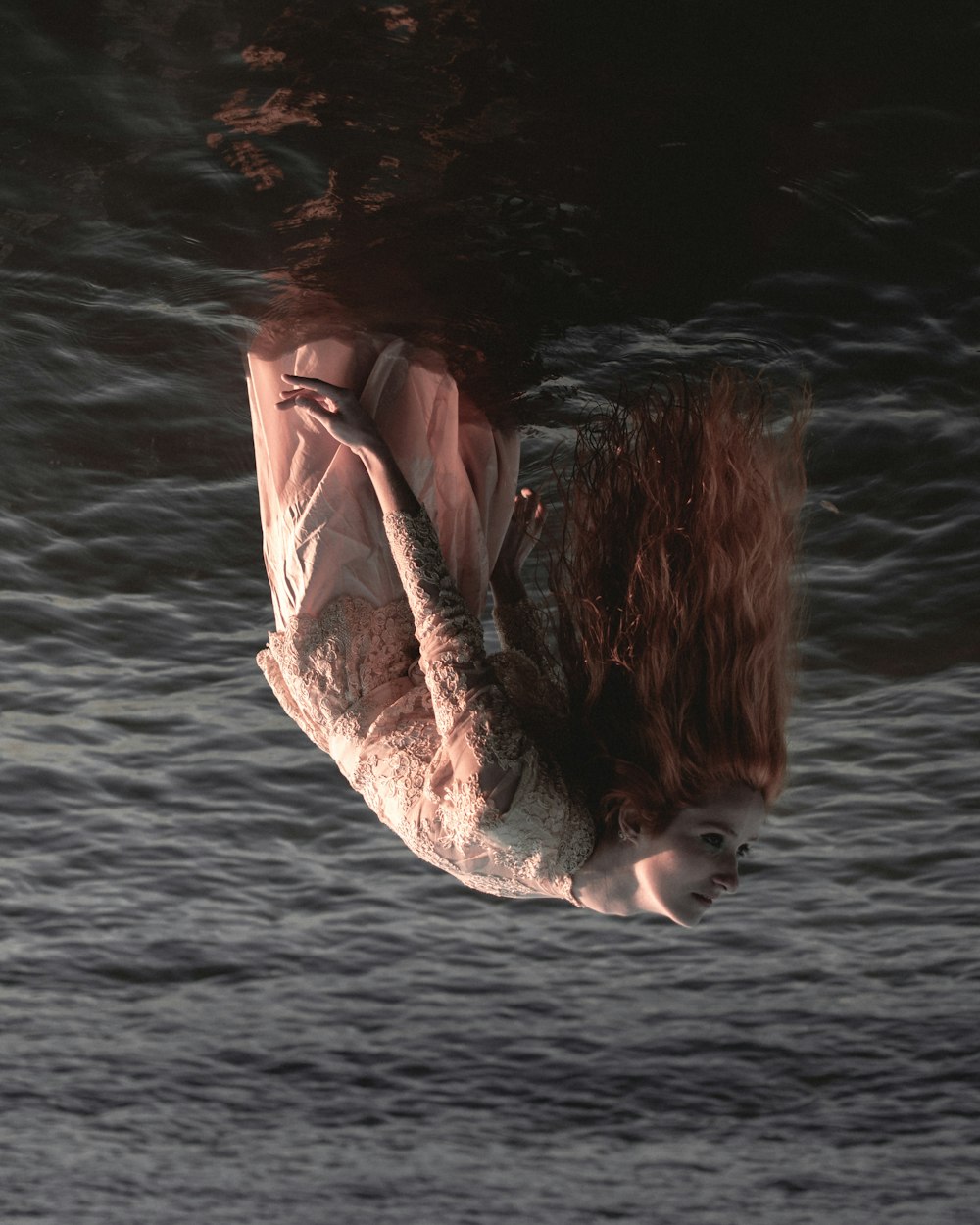 woman in white and brown long sleeve dress on water