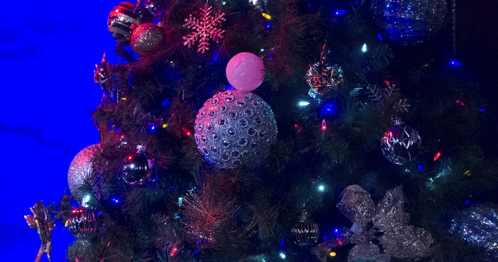 blue and pink baubles on christmas tree