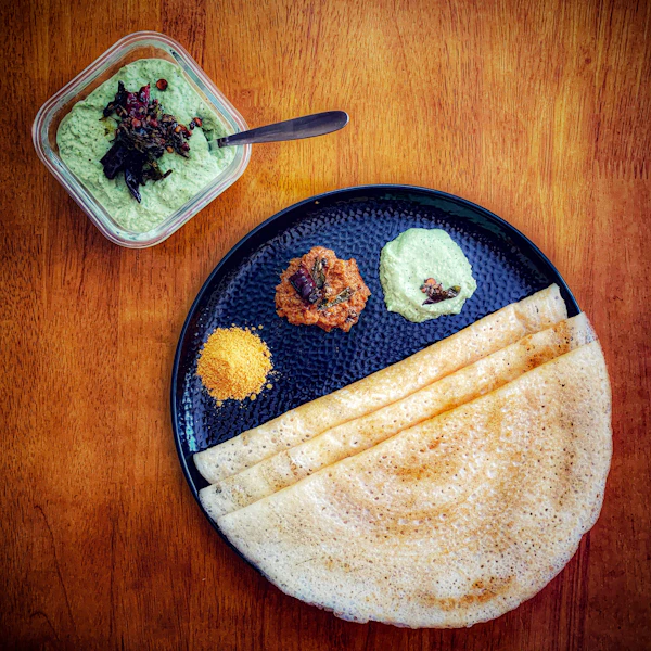 Podi dosa dusted with spicy gunpowder podi and drizzled with oil