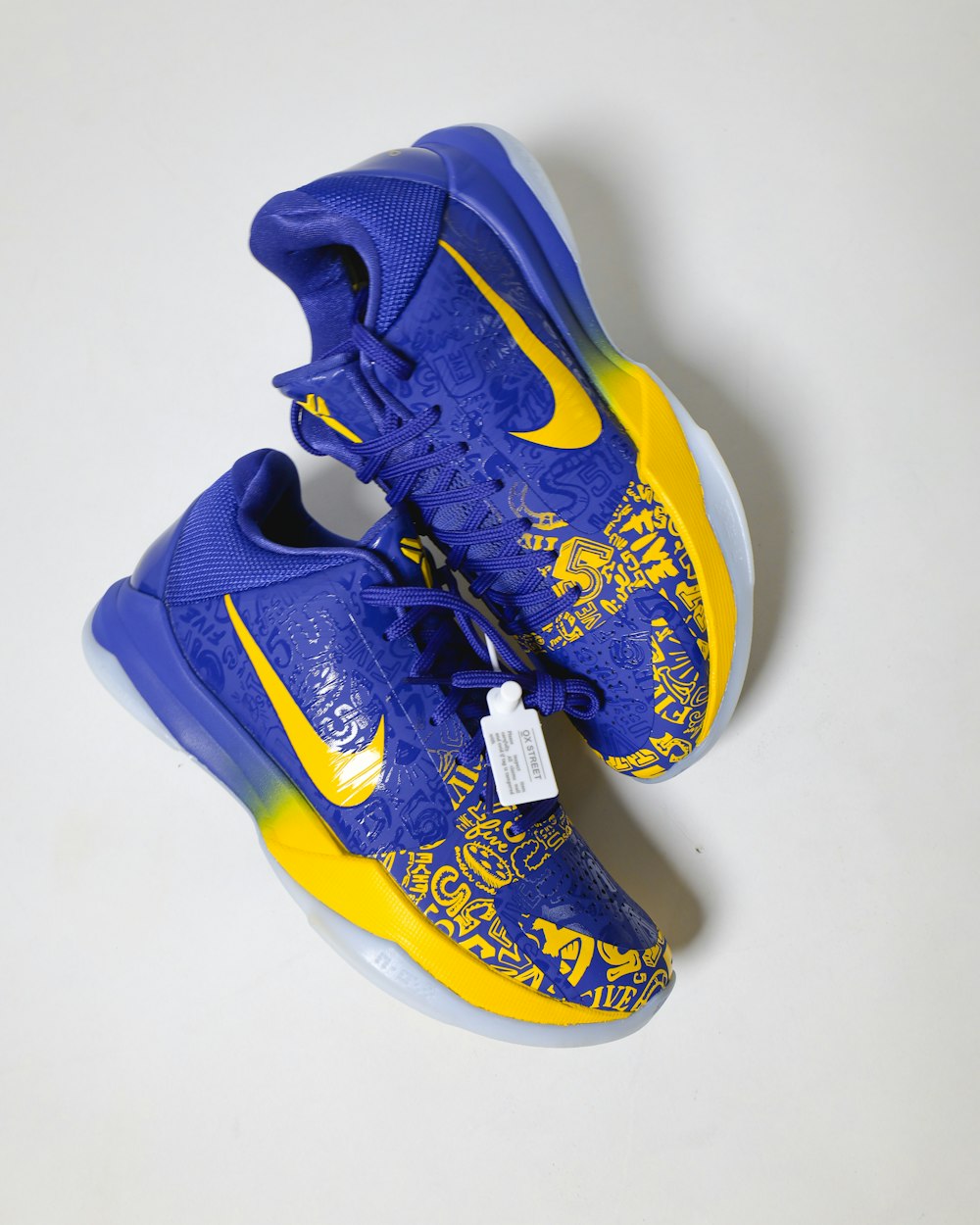 blue and yellow nike athletic shoes