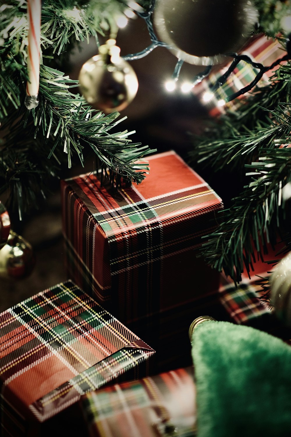 green christmas tree with red and white plaid textile