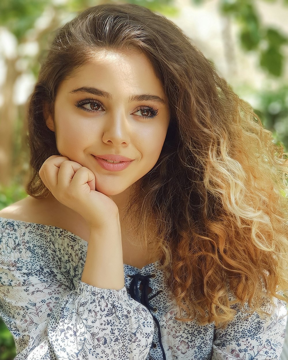 woman in gray and white floral dress