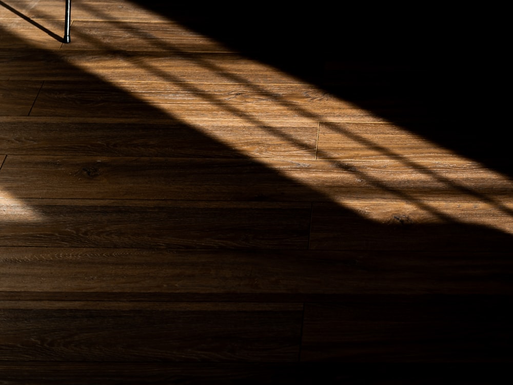 brown wooden floor with white metal frame