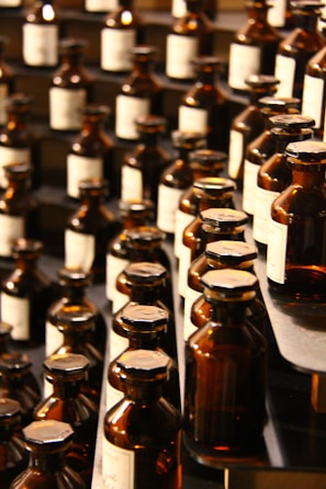 Rows of sealed medicine bottles lined up on shelves in a well-organized pharmaceutical warehouse.