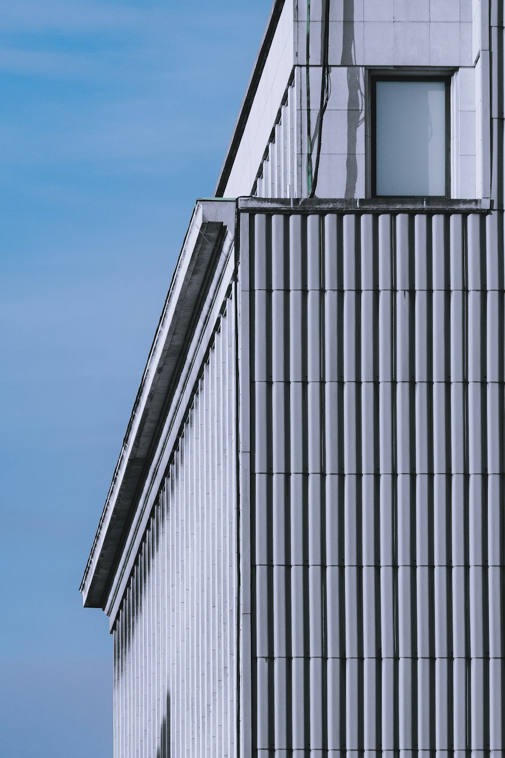 white and black building under blue sky during daytime