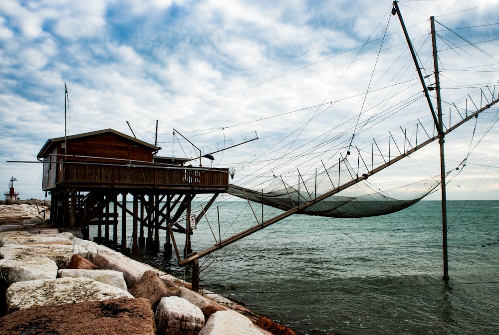 brown wooden dock on body of water during daytime