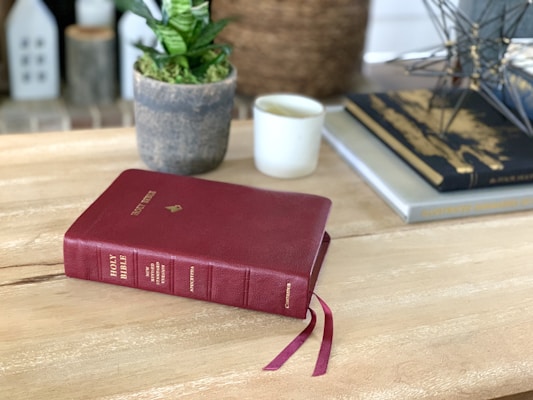 red book on brown wooden table