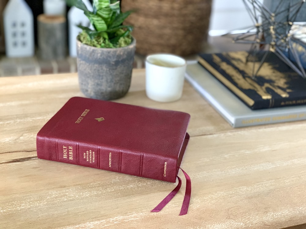 red book on brown wooden table