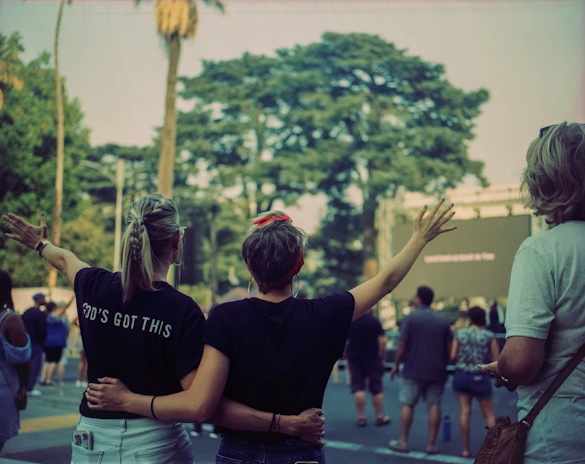 Volunteers warmly embracing each other during a Breath of God outreach event.