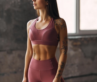 woman in pink sports bra and pink leggings