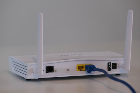 Engineer installing a wireless access point