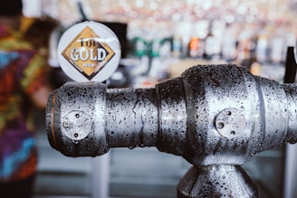 Close-up of a freshly installed beer tap system gleaming under warm pub lighting.