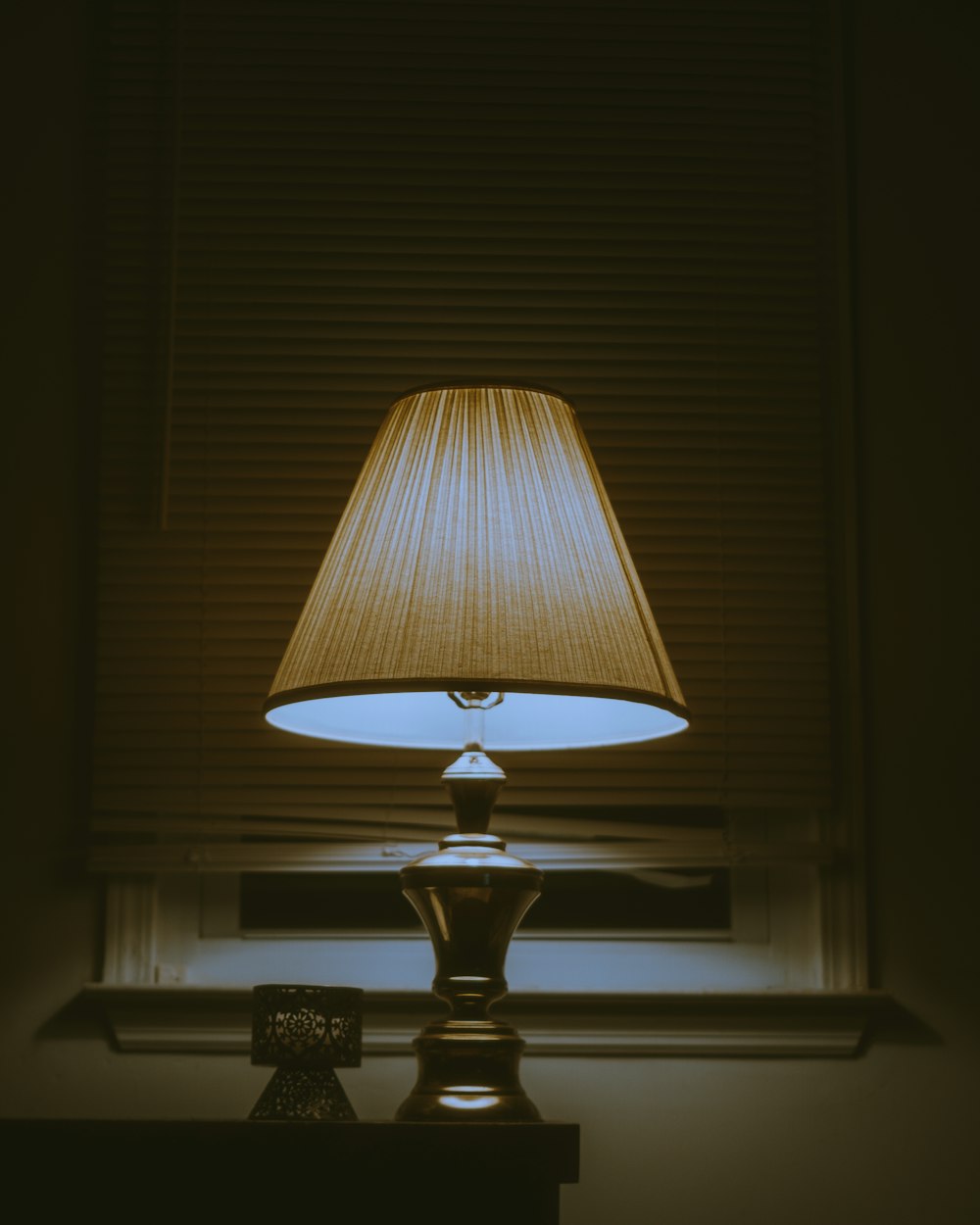 brown table lamp on brown wooden table