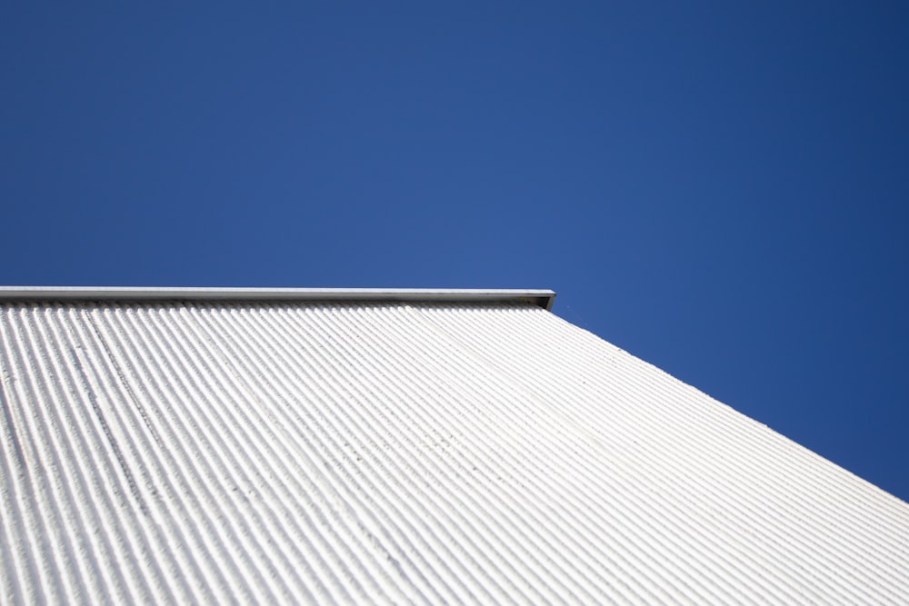white and gray concrete building under blue sky during daytime