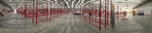 Wide shot of a large industrial space featuring smooth, high-performance epoxy flooring