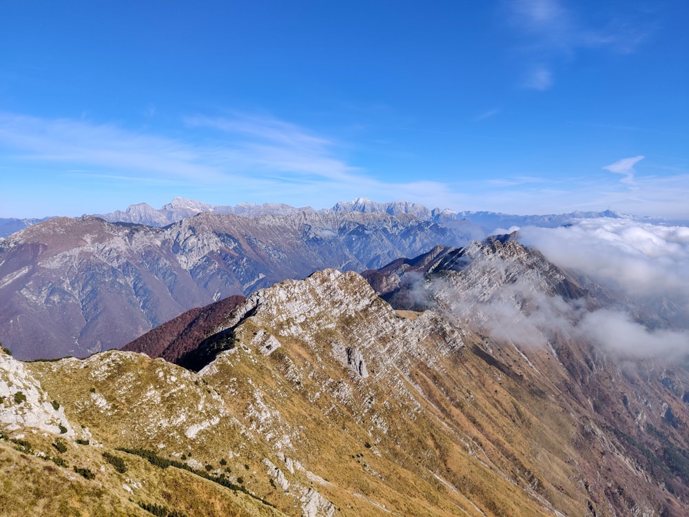 brown and green mountains under blue sky during daytime