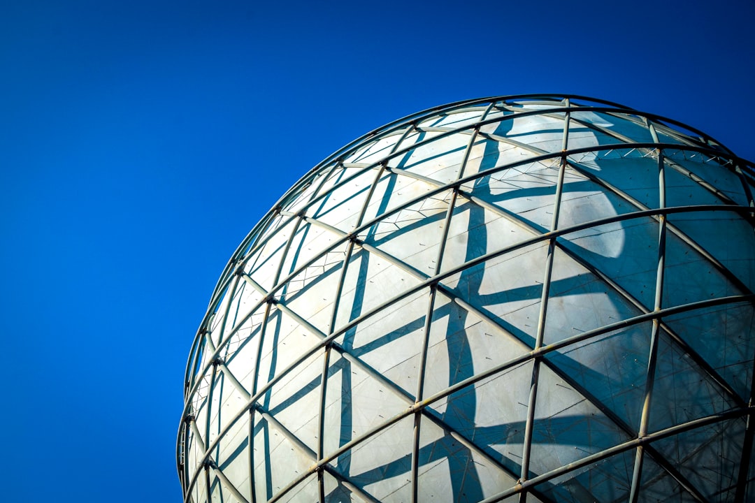 white round building under blue sky during daytime