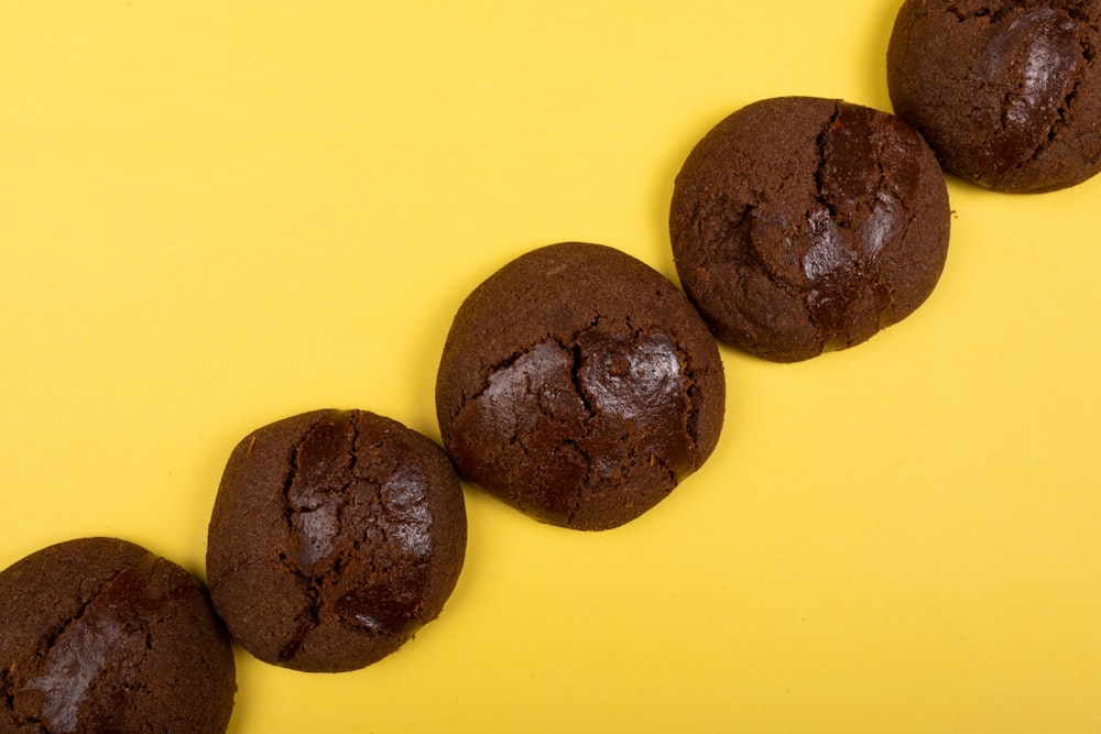 black round cookies on yellow surface