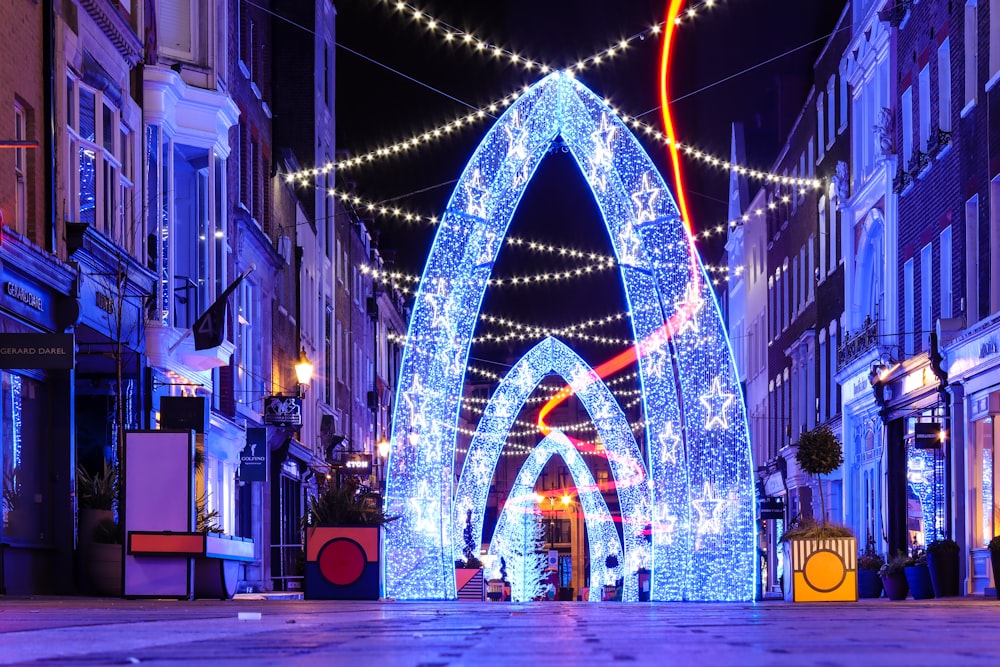 blue and yellow string lights on street during night time