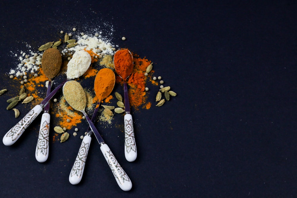 black and silver kitchen knife beside brown and white round fruits