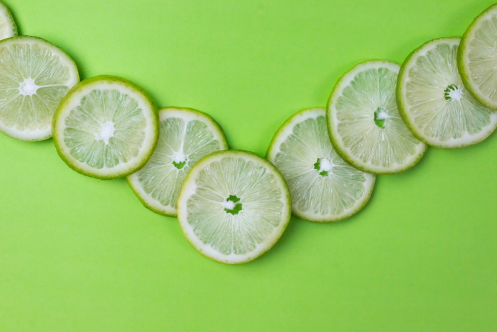 sliced lemon on green surface