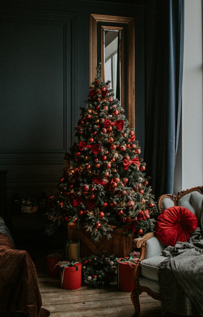 Green Christmas trees with red baubles Photo by Alsu Vershinina on unsplash.com - Monochromatic Christmas tree decorations