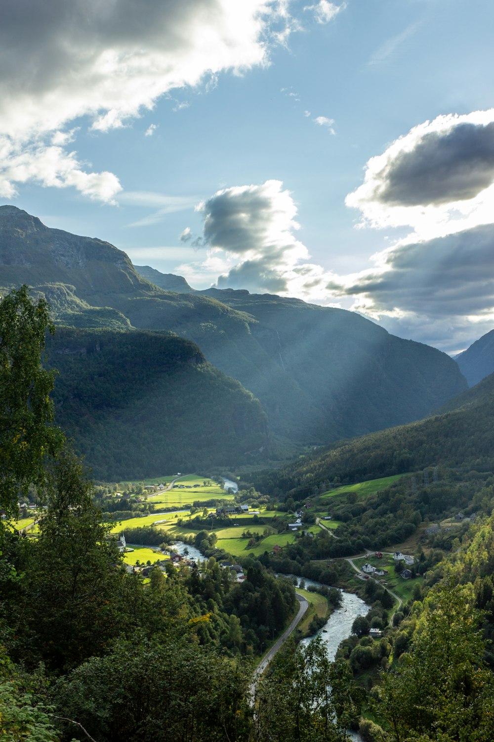 green mountains under white clouds during daytime