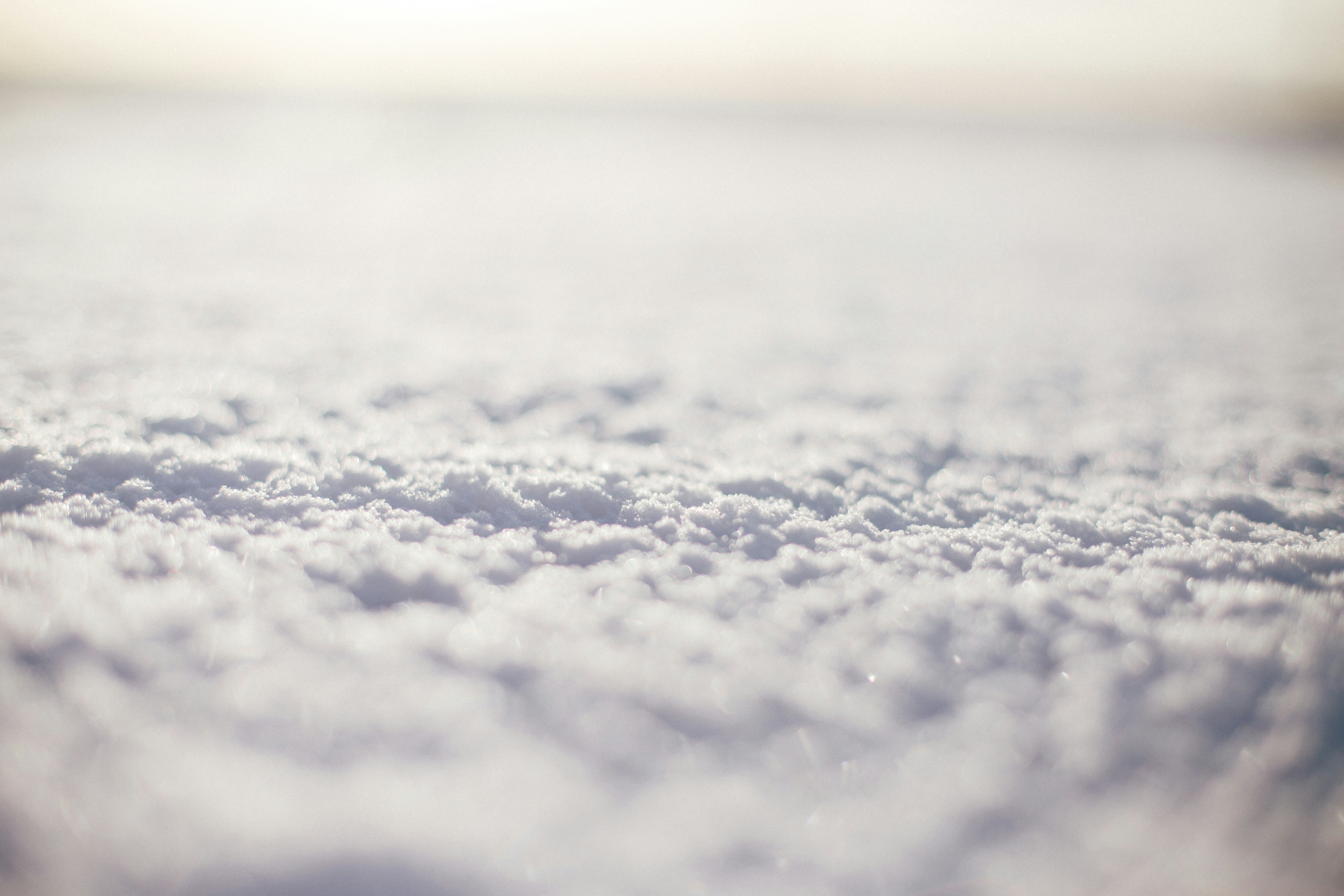 white snow on brown soil