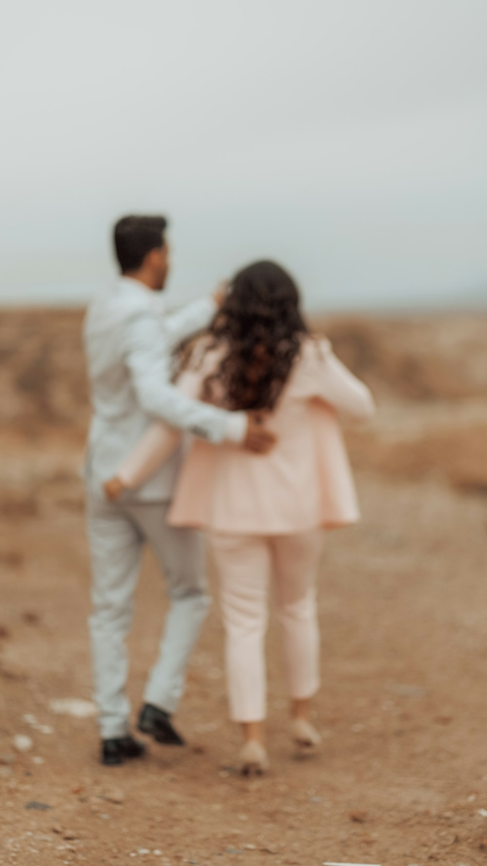 man and woman kissing each other during daytime