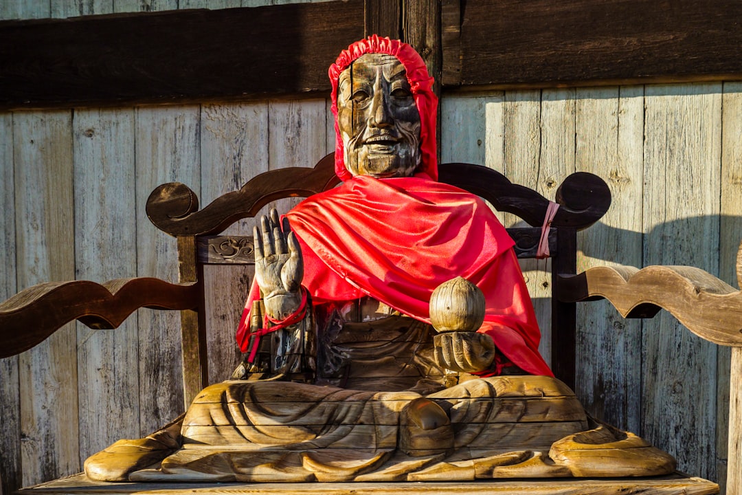 red and gold buddha figurine