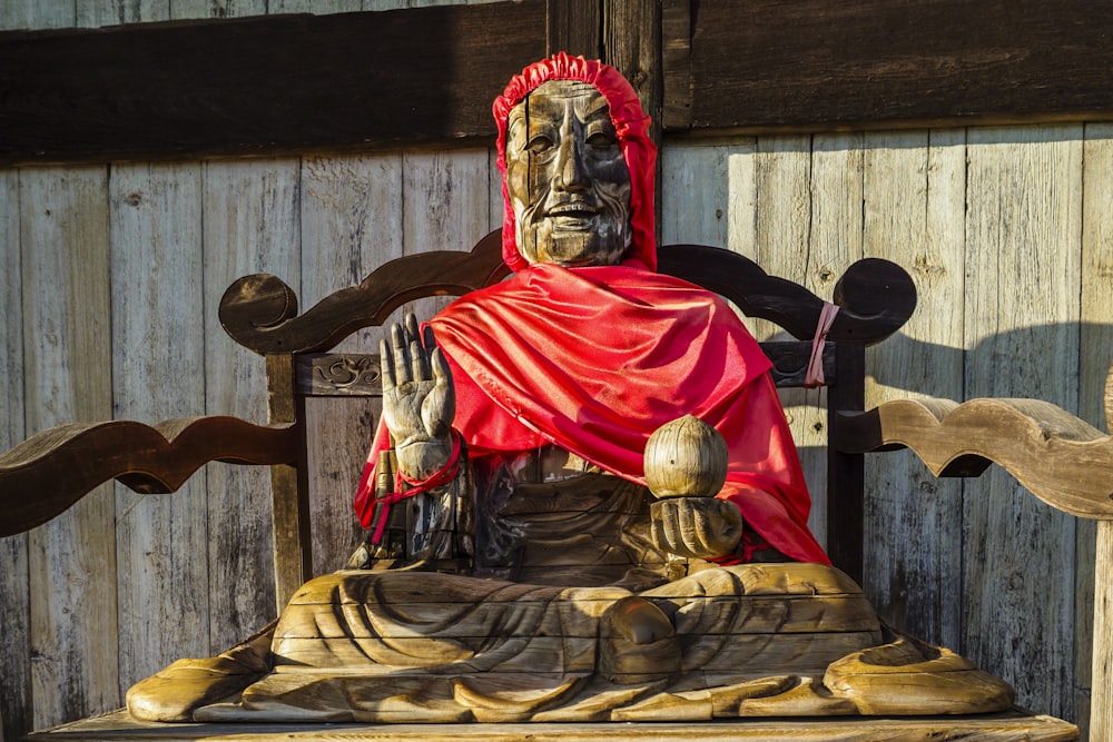 red and gold buddha figurine