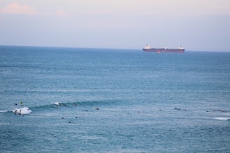 white ship on sea during daytime